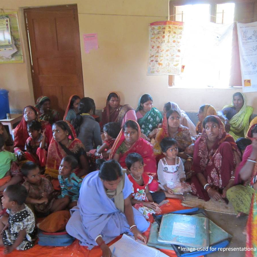 Helping group of ladies and children