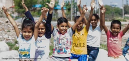 An image containing children who are smiling after getting education with the help of non profit organizations.