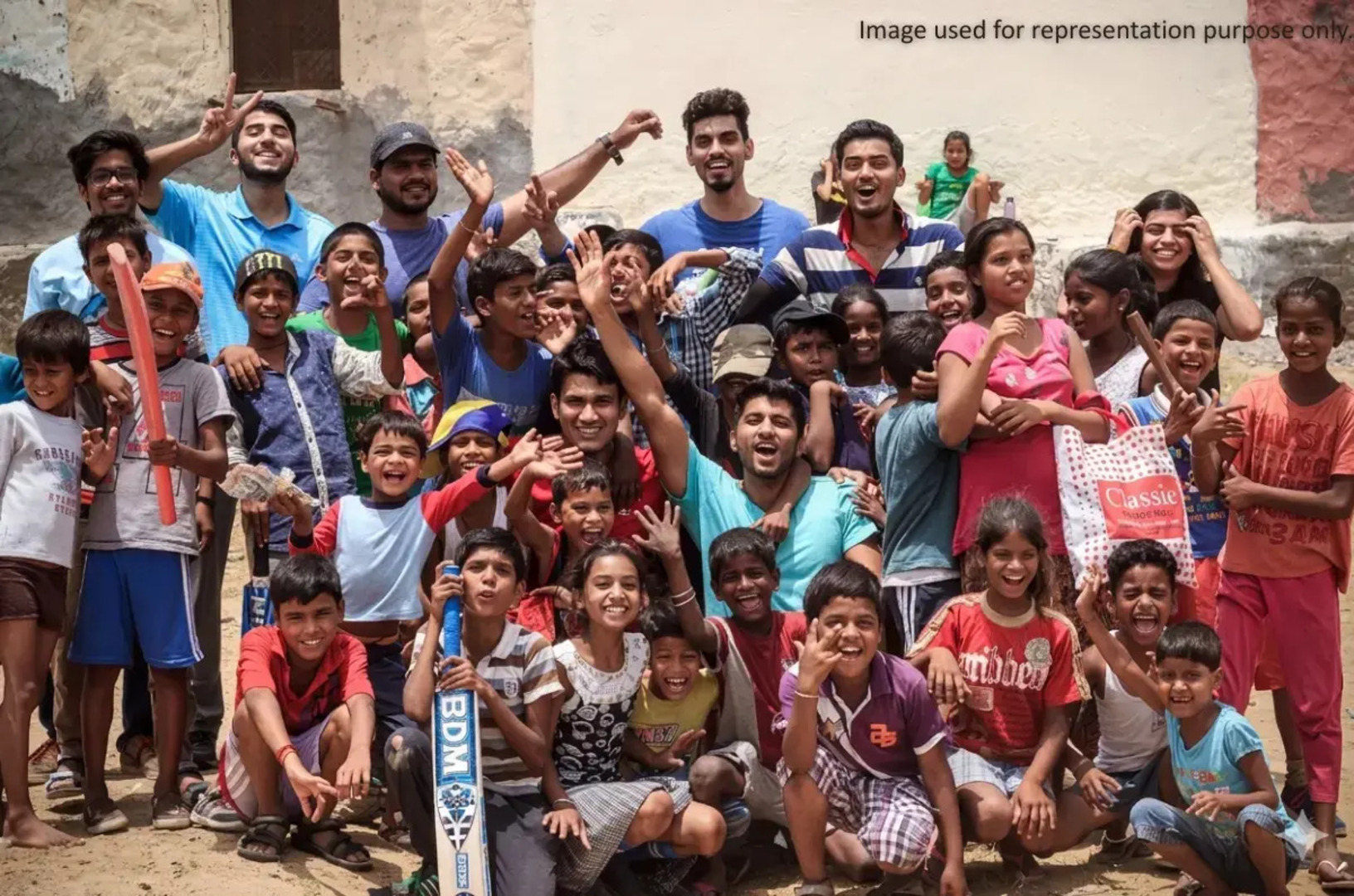 Children and volunteers participating in a community event promoting child rights, education, and inclusion.