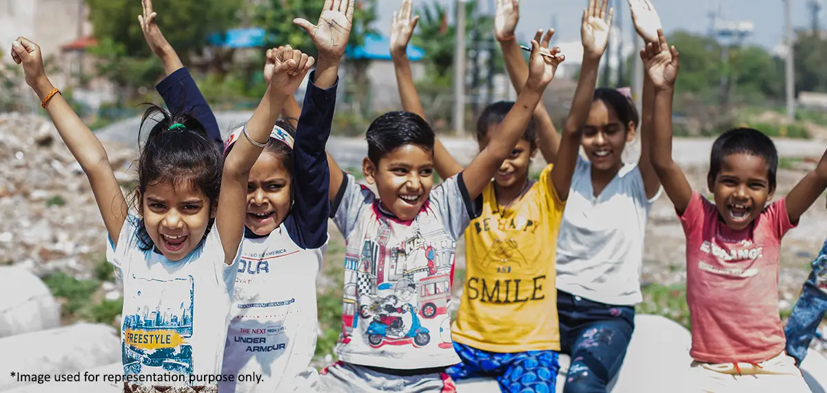 An image containing children who are smiling after getting education with the help of non profit organizations.